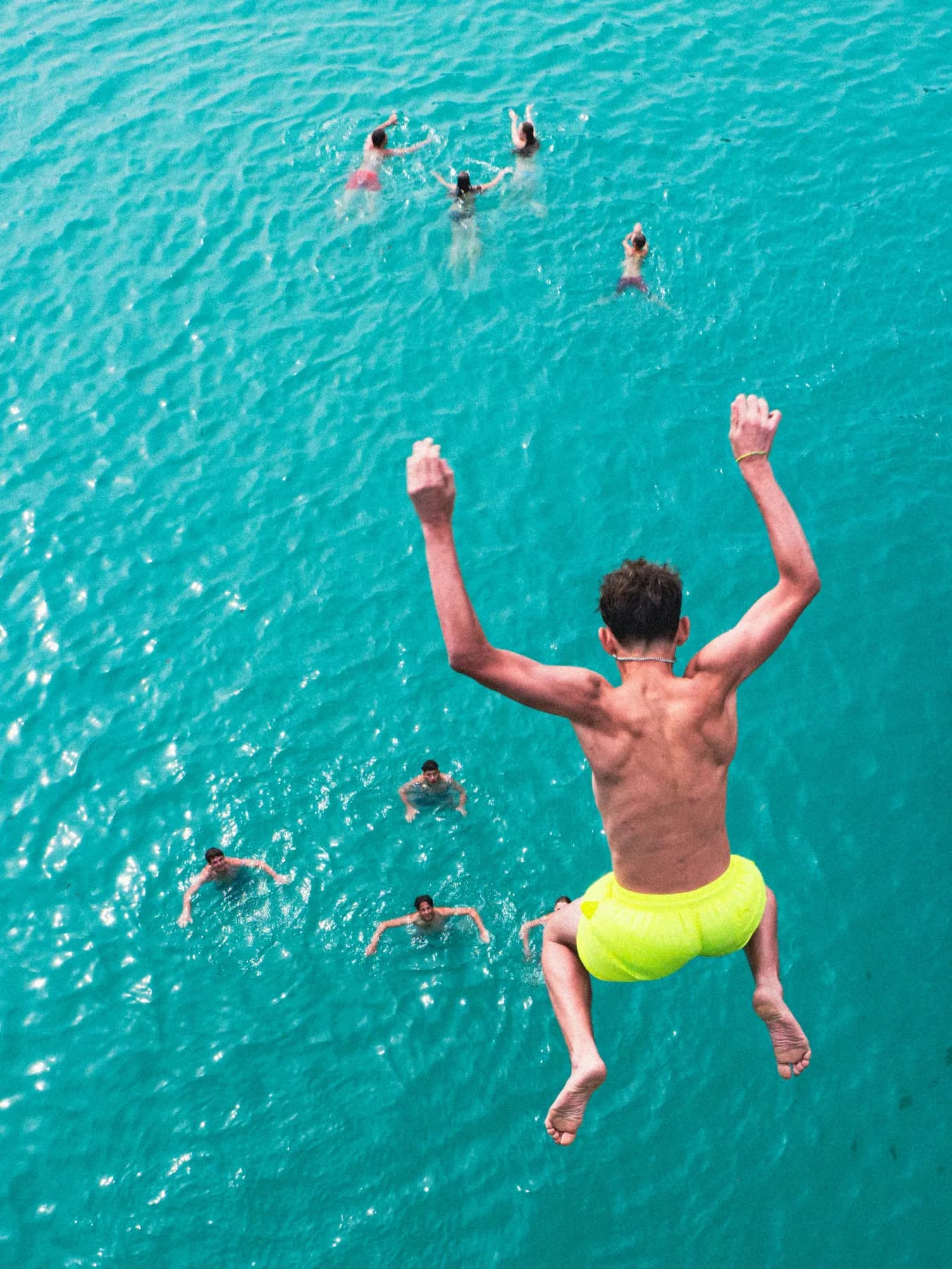 Guests swimming together off the stern