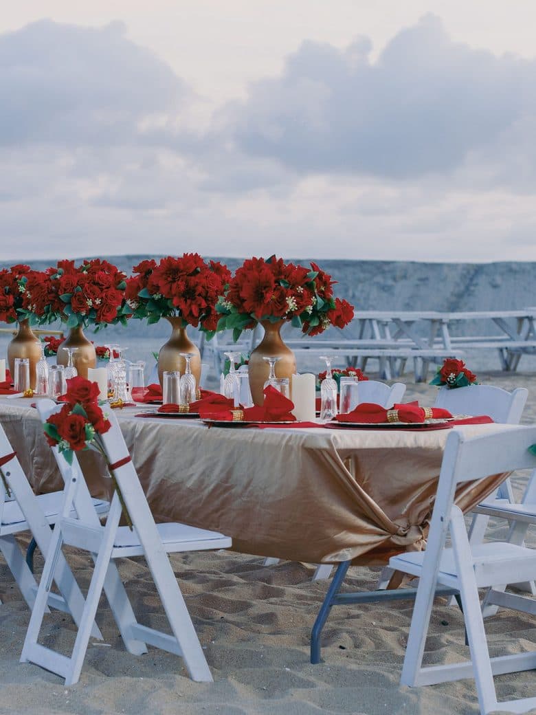 Beachfront dinner set for a private charter evening