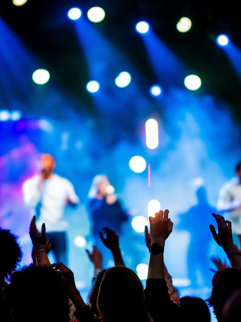 Crowd and stage lights at an open-air concert