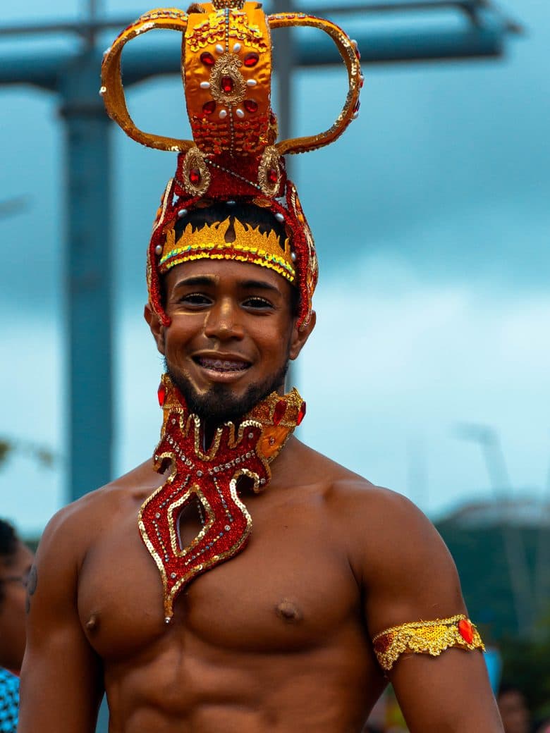 Carnival king in a gold and crimson headdress