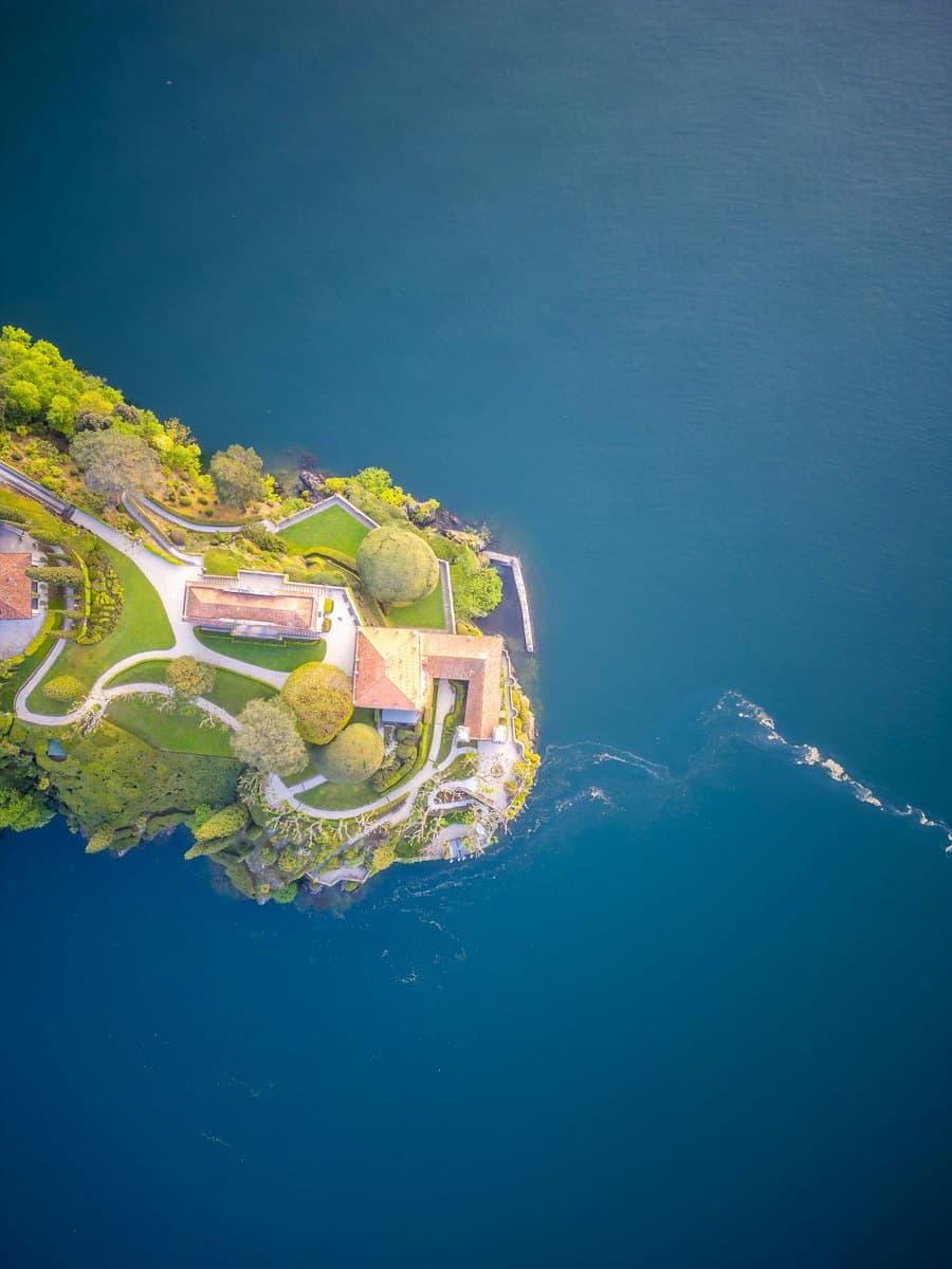 Aerial view of a waterfront estate on a wooded headland